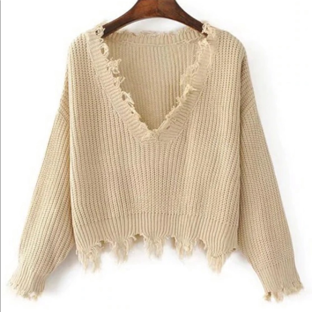 Loose ripped V neck sweater. One Size